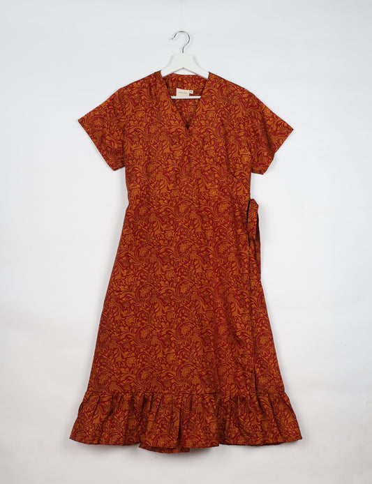 Embrace timeless elegance with our MIDI WRAP DRESS – a midi-length beauty featuring a v-neck, flattery from all angles, and a charming sari belt. Crafted from sustainable materials, this dress embodies ethical clothing and green fashion. Sophisticated with a frill tier at the hem and short cap sleeves, this dress is perfect for any occasion. Tie up the beautifully crafted sari belt on the side for a versatile, stylish, and eco-friendly look.