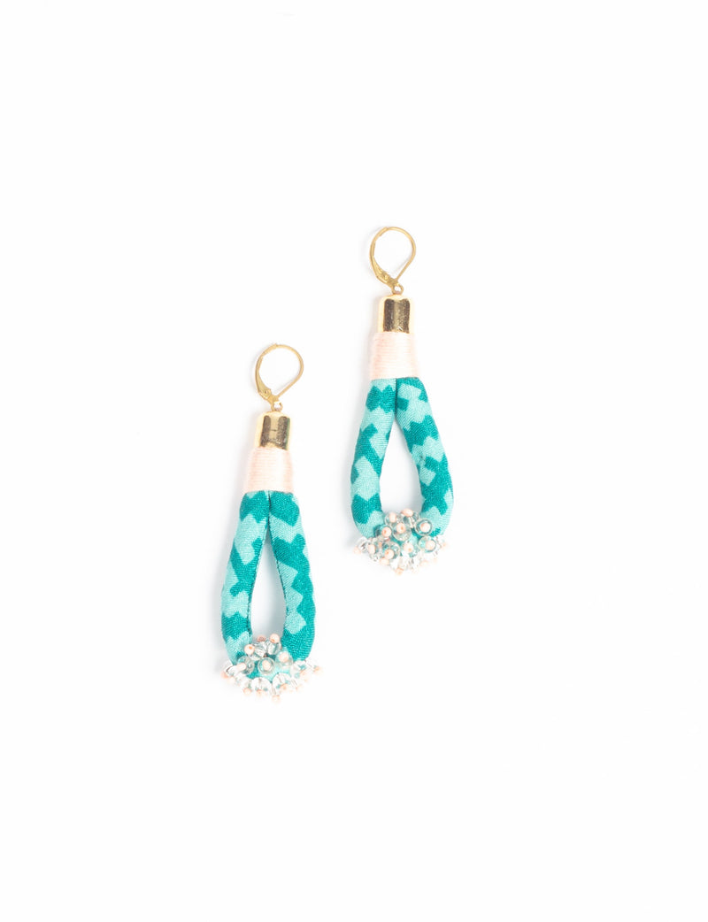 Green patterned fabric loop drop earrings with gold-tone hooks and small clear and pink beads at the bottom