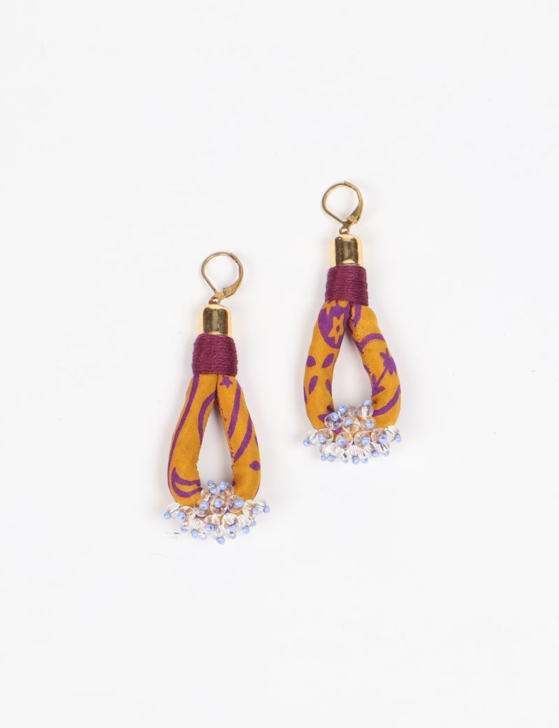 Yellow and purple patterned fabric drop earrings with gold-tone hooks and clusters of clear and blue beads at the bottom