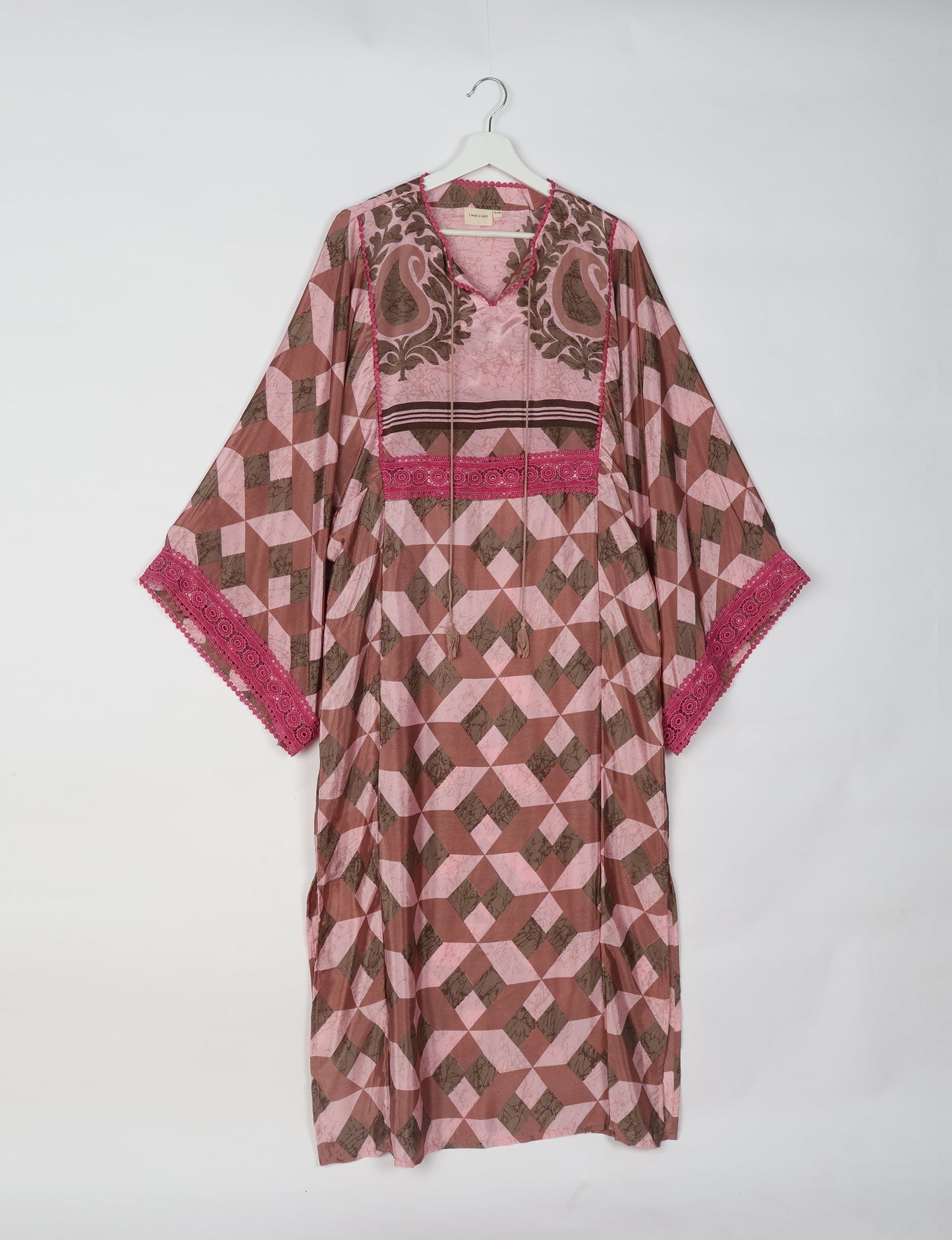 Maxi Kaftan with cotton lace on sleeves and midriff, featuring a tie-up neckline with tassels. Ankle-length, eco-friendly fashion made from recycled materials, offering sustainable women’s clothing for a chic, earth-friendly wardrobe.
