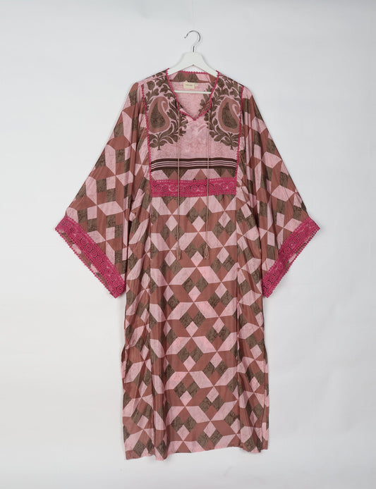 Maxi Kaftan with cotton lace on sleeves and midriff, featuring a tie-up neckline with tassels. Ankle-length, eco-friendly fashion made from recycled materials, offering sustainable women’s clothing for a chic, earth-friendly wardrobe.