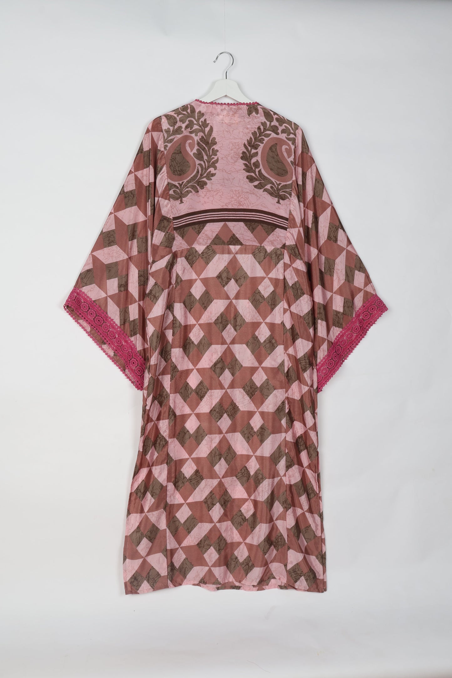 Maxi Kaftan with cotton lace on sleeves and midriff, featuring a tie-up neckline with tassels. Ankle-length, eco-friendly fashion made from recycled materials, offering sustainable women’s clothing for a chic, earth-friendly wardrobe.