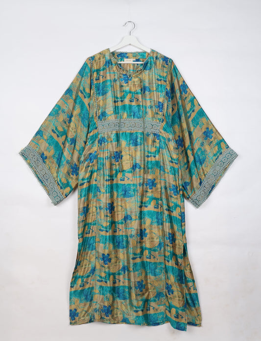 Maxi Kaftan with cotton lace on sleeves and midriff, featuring a tie-up neckline with tassels. Ankle-length, eco-friendly fashion made from recycled materials, offering sustainable women’s clothing for a chic, earth-friendly wardrobe.