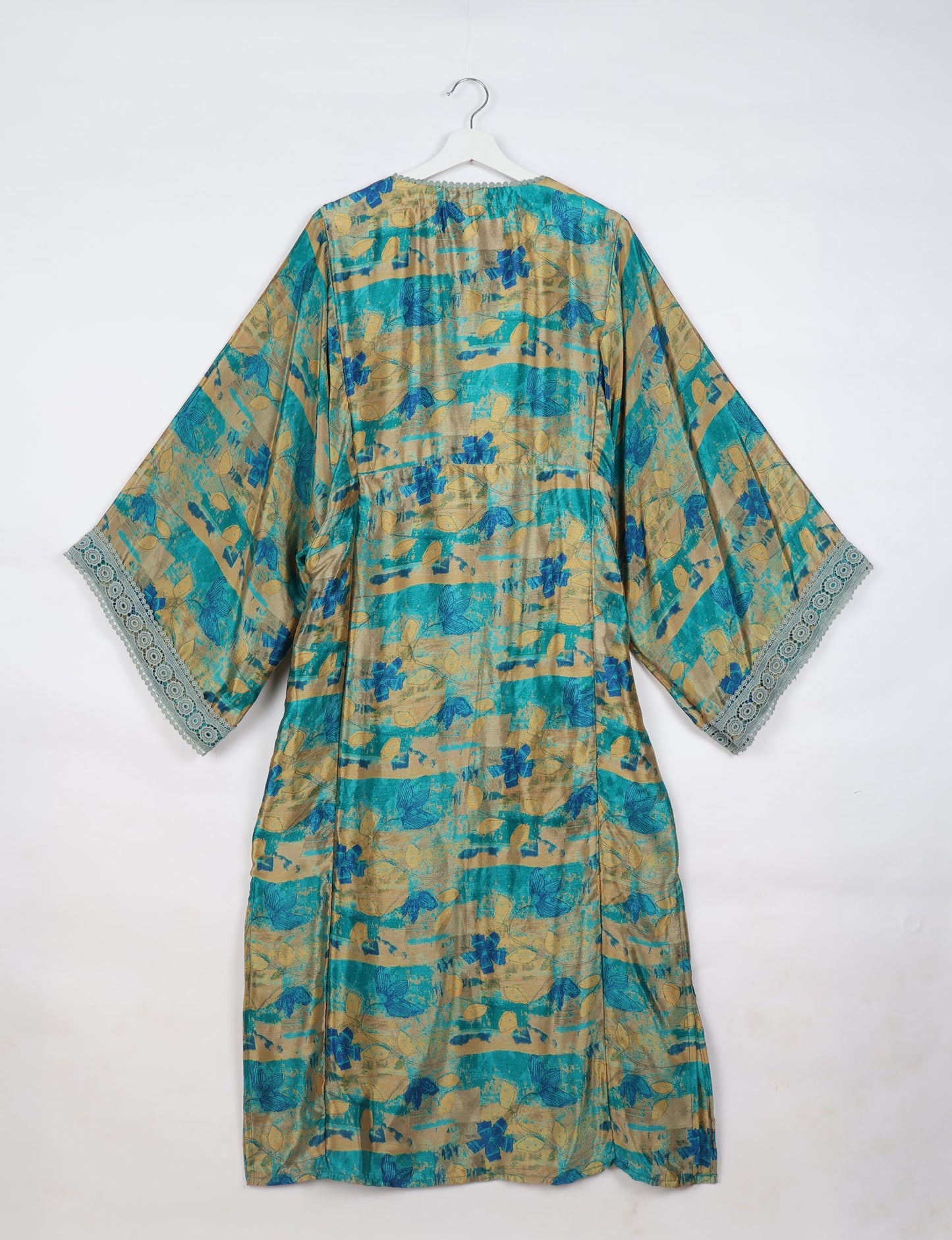 Maxi Kaftan with cotton lace on sleeves and midriff, featuring a tie-up neckline with tassels. Ankle-length, eco-friendly fashion made from recycled materials, offering sustainable women’s clothing for a chic, earth-friendly wardrobe.