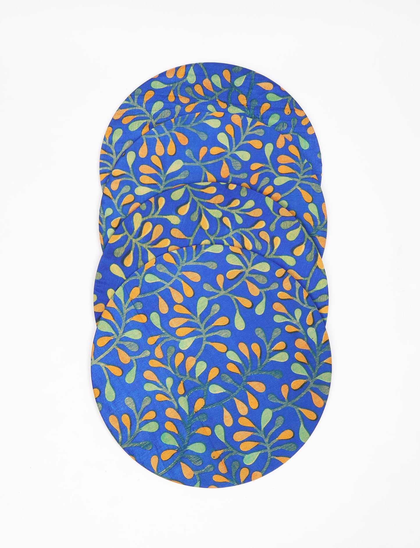 Upgrade your table settings with our Round Placemat Set of 4. These circular placemats, made from sustainable 3 mm thick MDF, feature covers crafted from round sari sleeves. Easily washable and elasticated, these placemats offer a stylish and eco-friendly solution for both table place settings and serving dishes. Make a sustainable statement with every meal.