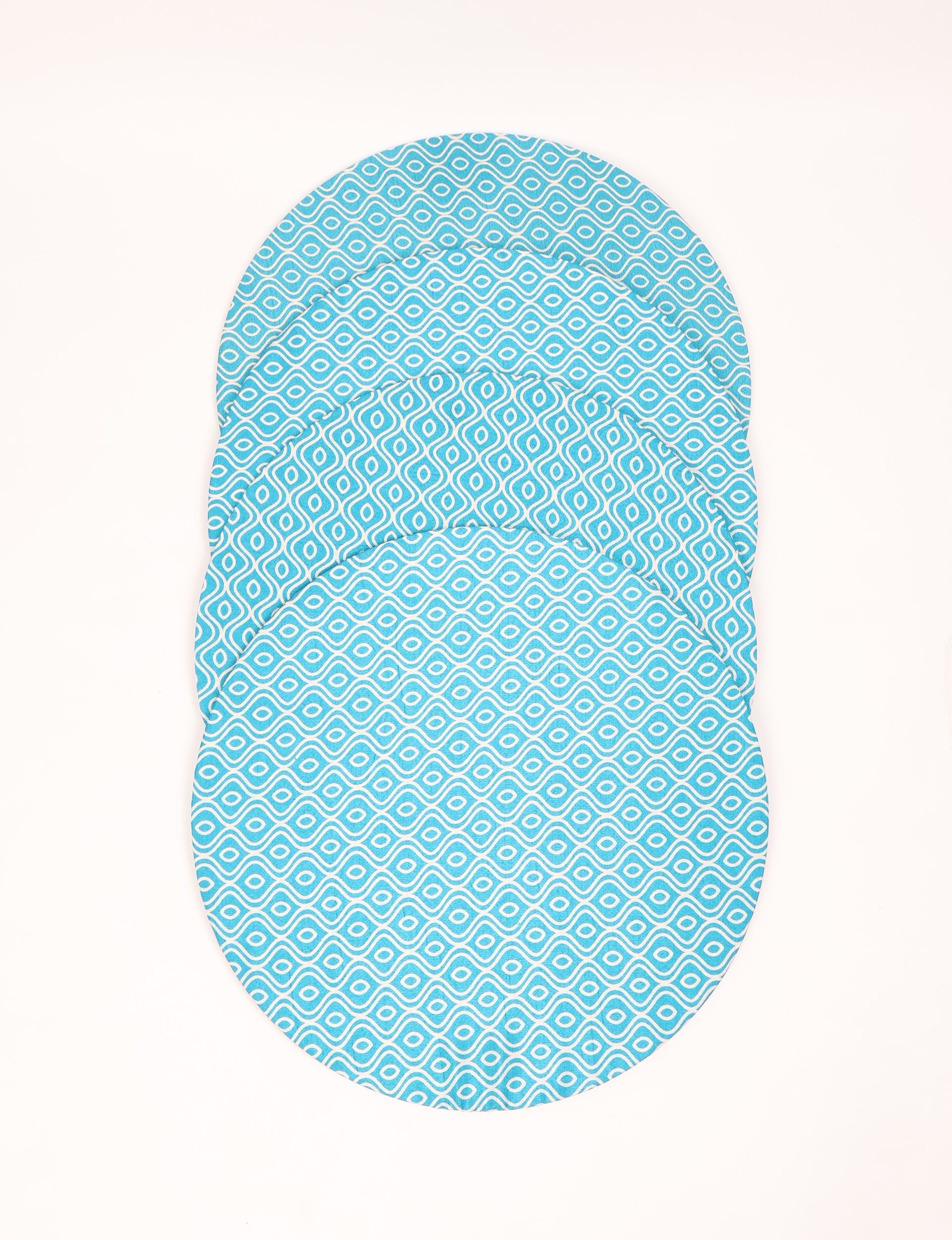 Set of four round blue placemats with white abstract geometric pattern, shown stacked flat on white background