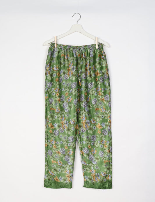 Elevate your wardrobe with our planet-friendly PULL-ON PANTS. Made from upcycled sari fabric, these eco-conscious pants offer a drawstring waist for a perfect fit. Tapered leg design ensures both style and comfort. Choose ethical, green fashion that supports artisans and sustainable living.