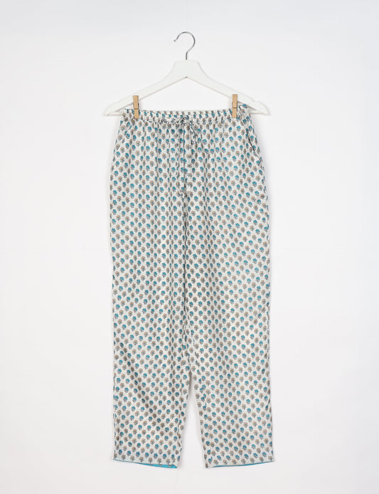 Elevate your wardrobe with our planet-friendly PULL-ON PANTS. Made from upcycled sari fabric, these eco-conscious pants offer a drawstring waist for a perfect fit. Tapered leg design ensures both style and comfort. Choose ethical, green fashion that supports artisans and sustainable living.