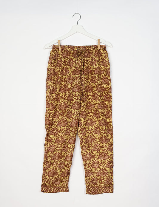 Elevate your wardrobe with our planet-friendly PULL-ON PANTS. Made from upcycled sari fabric, these eco-conscious pants offer a drawstring waist for a perfect fit. Tapered leg design ensures both style and comfort. Choose ethical, green fashion that supports artisans and sustainable living.