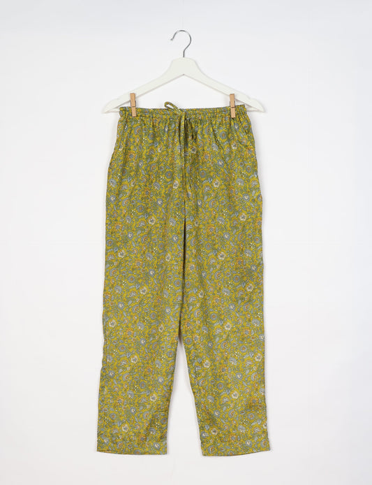 Elevate your wardrobe with our planet-friendly PULL-ON PANTS. Made from upcycled sari fabric, these eco-conscious pants offer a drawstring waist for a perfect fit. Tapered leg design ensures both style and comfort. Choose ethical, green fashion that supports artisans and sustainable living.