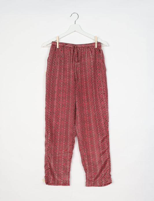 Elevate your wardrobe with our planet-friendly PULL-ON PANTS. Made from upcycled sari fabric, these eco-conscious pants offer a drawstring waist for a perfect fit. Tapered leg design ensures both style and comfort. Choose ethical, green fashion that supports artisans and sustainable living.