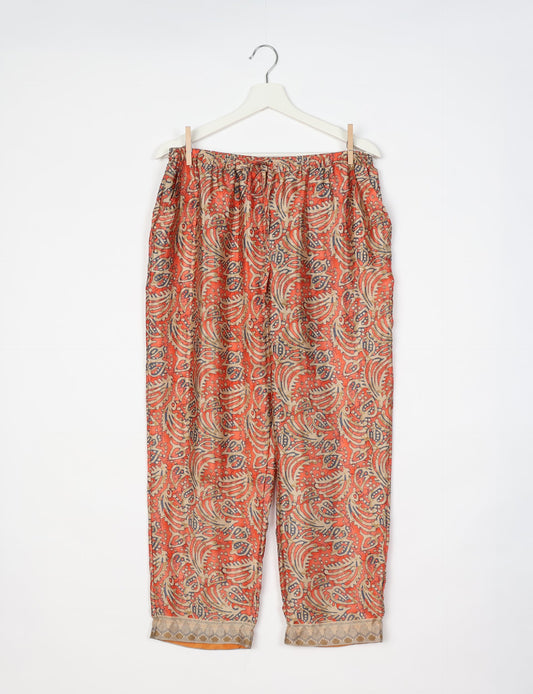 Elevate your wardrobe with our planet-friendly PULL-ON PANTS. Made from upcycled sari fabric, these eco-conscious pants offer a drawstring waist for a perfect fit. Tapered leg design ensures both style and comfort. Choose ethical, green fashion that supports artisans and sustainable living.