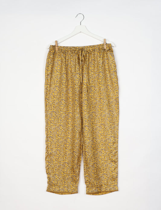 Elevate your wardrobe with our planet-friendly PULL-ON PANTS. Made from upcycled sari fabric, these eco-conscious pants offer a drawstring waist for a perfect fit. Tapered leg design ensures both style and comfort. Choose ethical, green fashion that supports artisans and sustainable living.