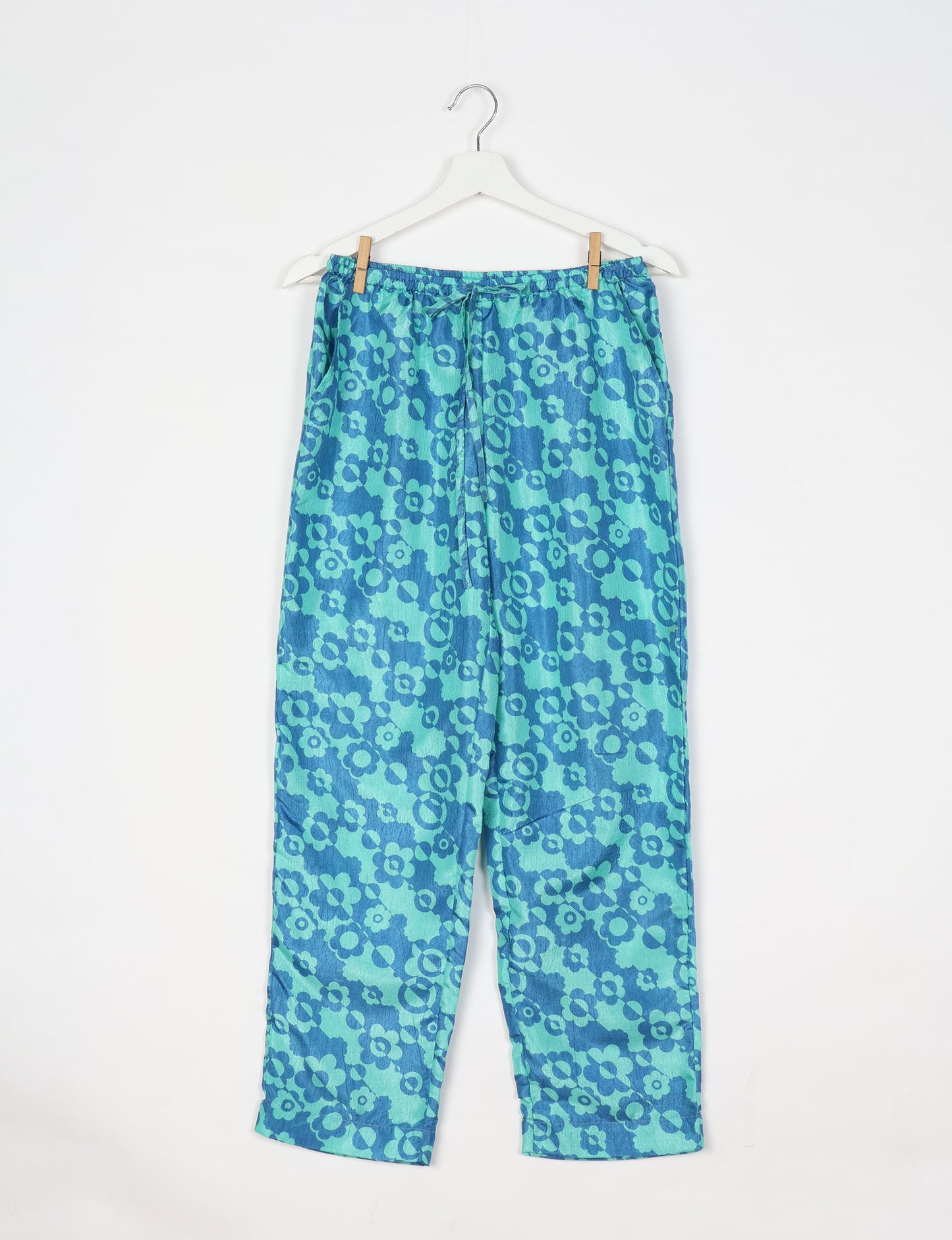 Elevate your wardrobe with our planet-friendly PULL-ON PANTS. Made from upcycled sari fabric, these eco-conscious pants offer a drawstring waist for a perfect fit. Tapered leg design ensures both style and comfort. Choose ethical, green fashion that supports artisans and sustainable living.