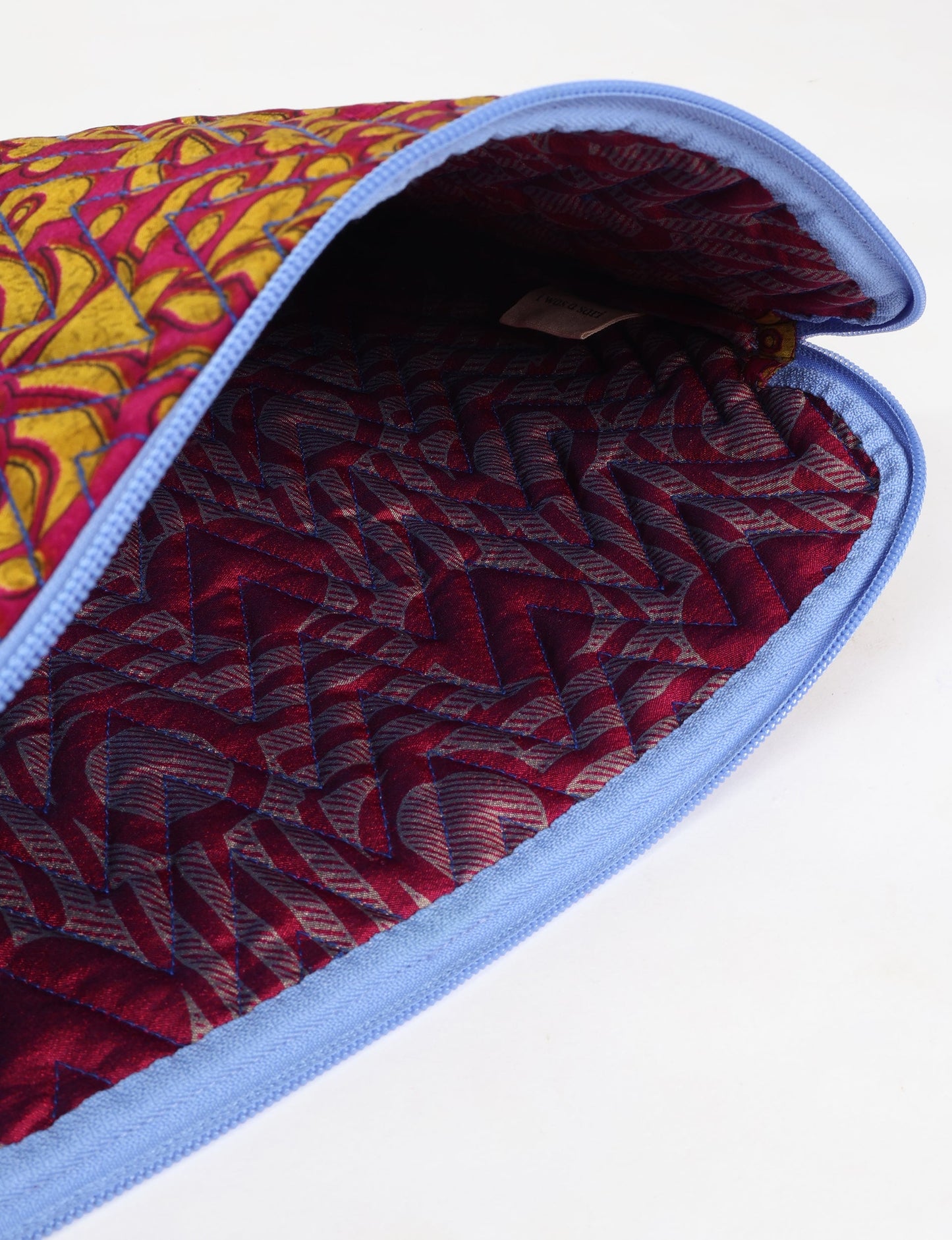 Eco-friendly meets tech-savvy in our QUILTED LAPTOP SLEEVE 13-14 inches. Stylishly quilted for durability, this sleeve offers protection and ethical fashion for your 13"-14" laptop. Secure your device with the zippered closure and carry it sustainably wherever you go.