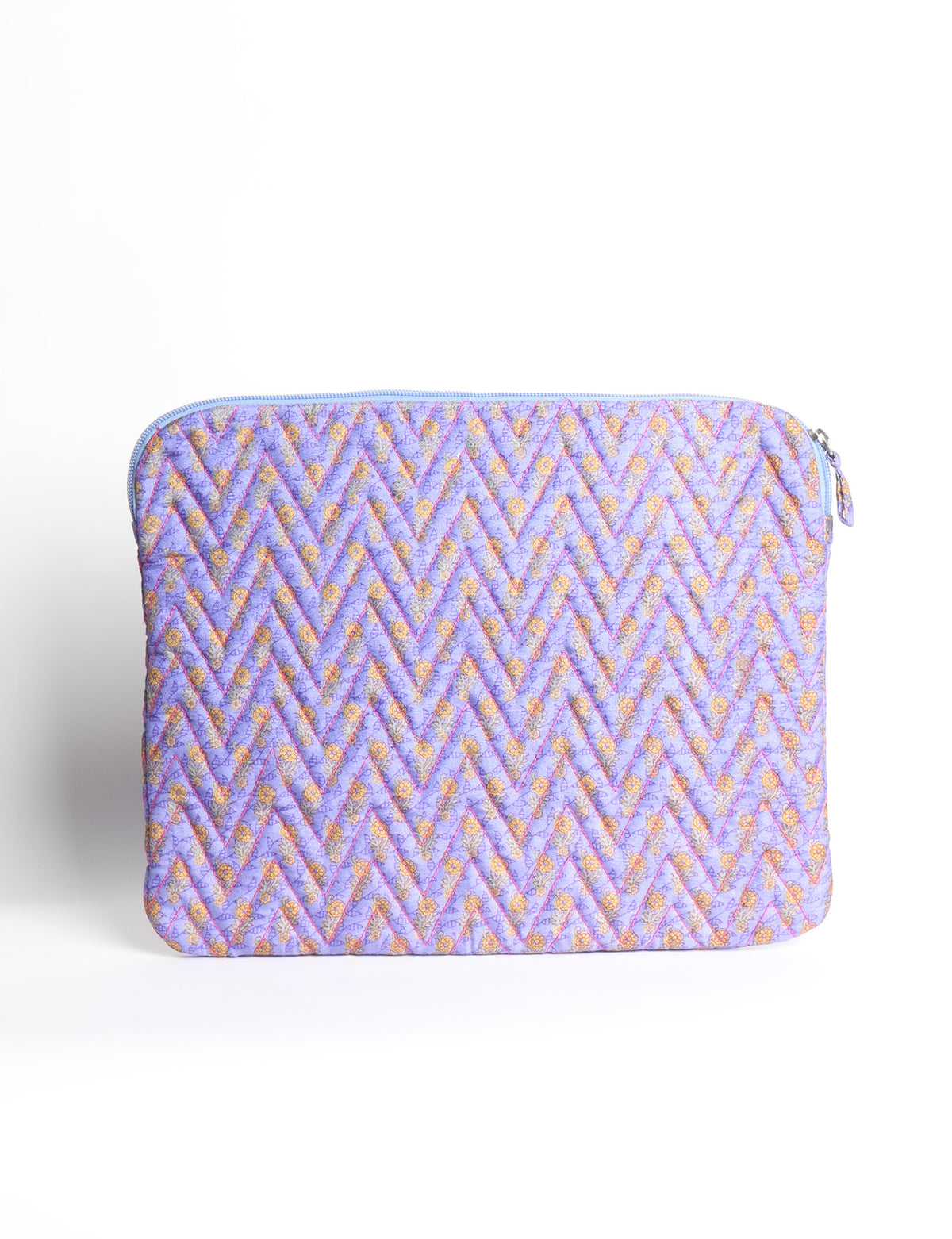 Quilted laptop sleeve with purple paisley pattern, blue zipper, and rounded corners, shown flat on white background