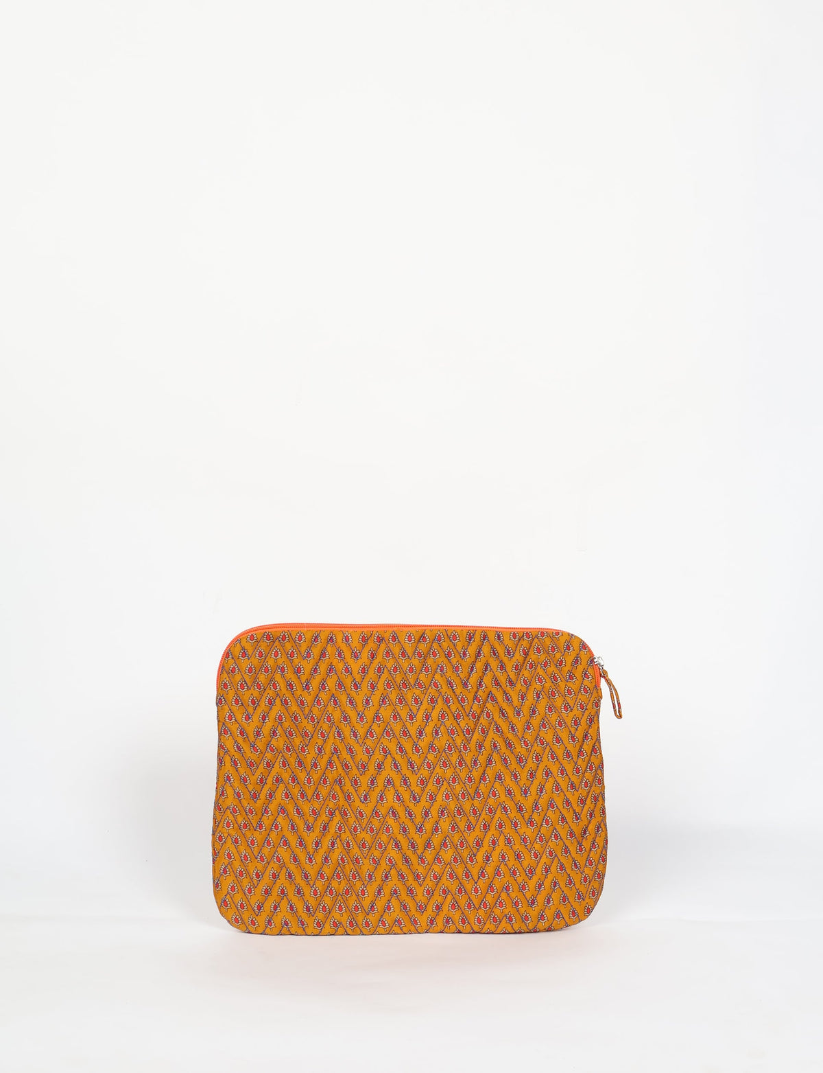 Quilted laptop sleeve with yellow fabric and small red and blue floral micro design, front view, standing upright