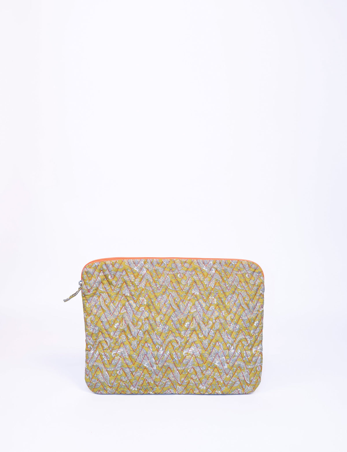 Quilted laptop sleeve in yellow with tropical floral pattern, orange zipper, shown flat against white background