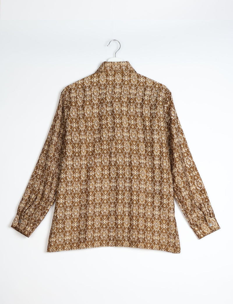 Beige and brown Indian ethnic patterned long-sleeve resort shirt shown from back on white hanger against white background