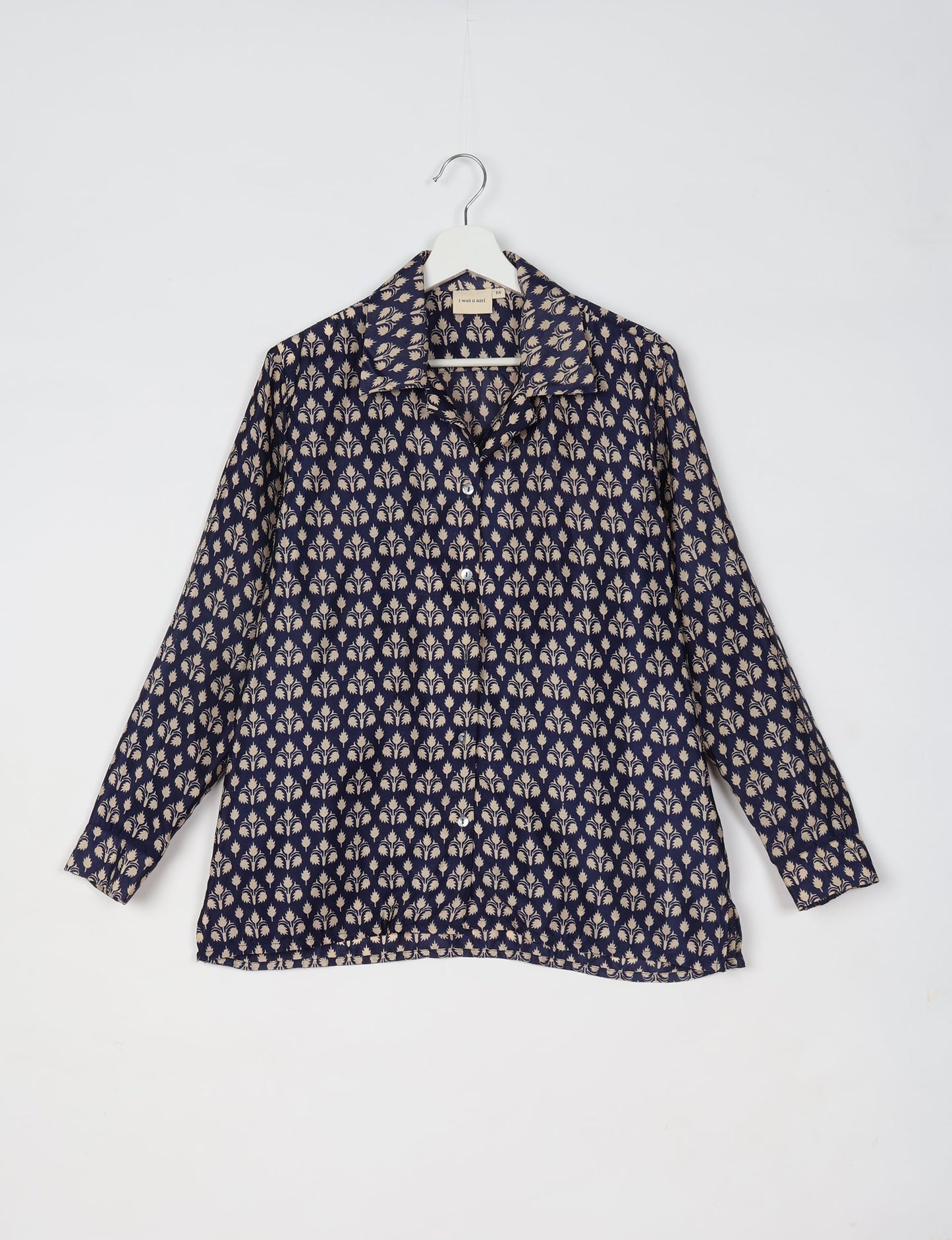 A person wearing a Resort Shirt, a sustainable fashion choice made from recycled materials.