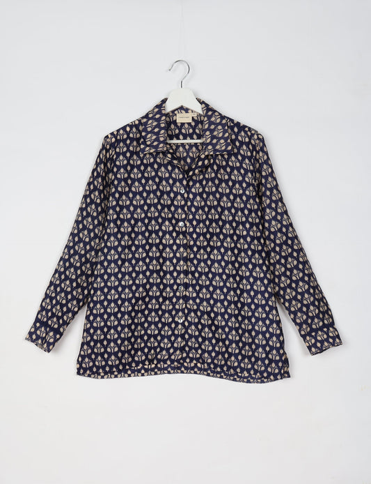 A person wearing a Resort Shirt, a sustainable fashion choice made from recycled materials.