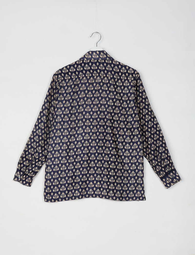Navy blue long-sleeve resort shirt with beige micro floral pattern, shown from back on white hanger against white background