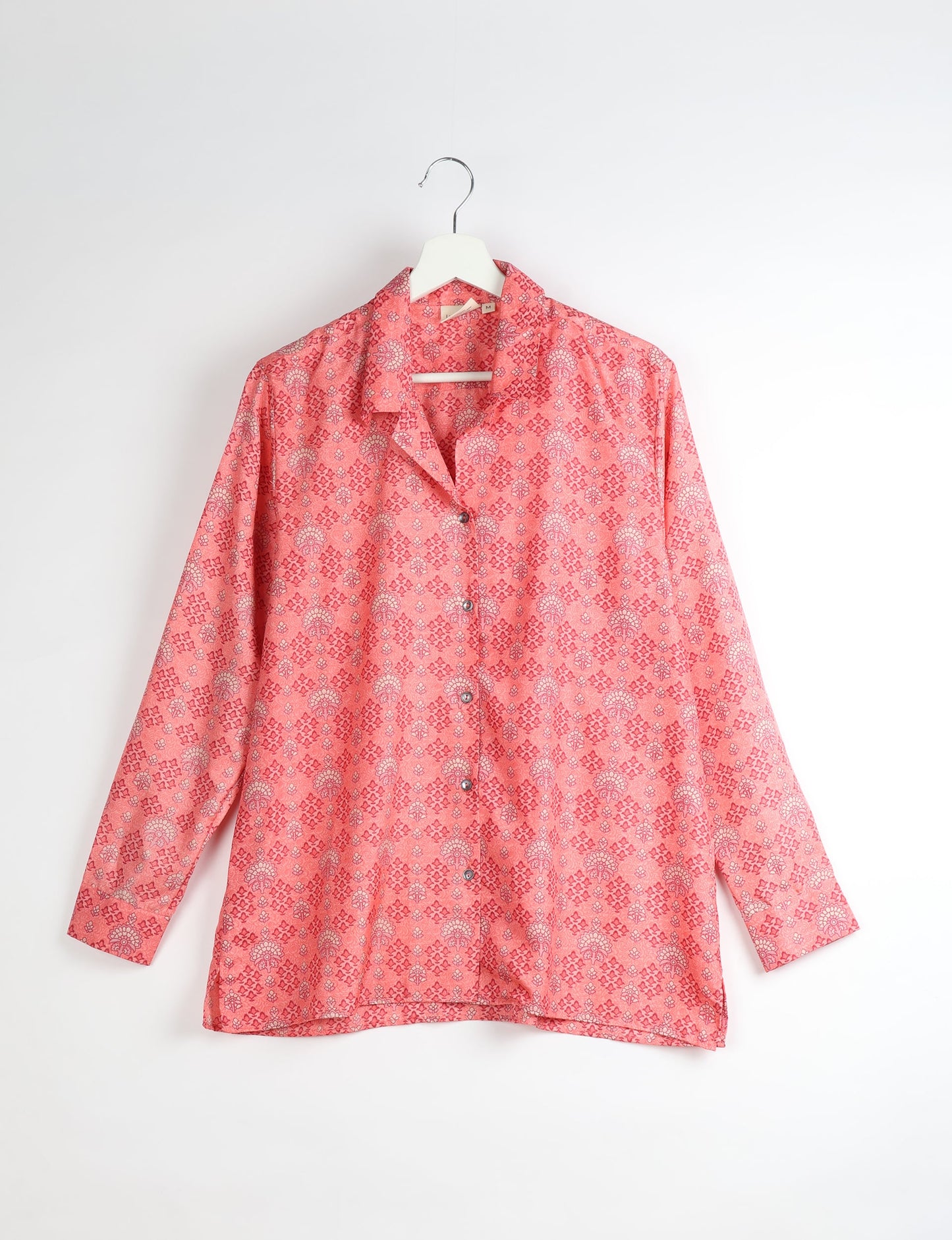 A person wearing a Resort Shirt, a sustainable fashion choice made from recycled materials.