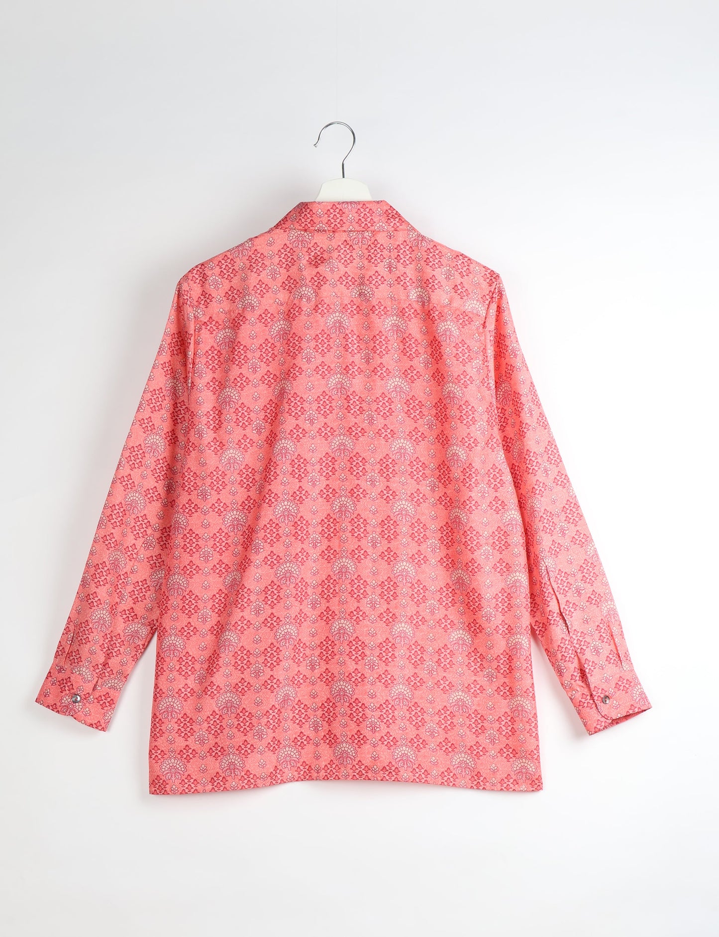 A person wearing a Resort Shirt, a sustainable fashion choice made from recycled materials.