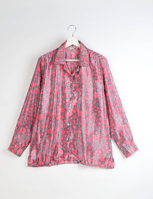 A person wearing a Resort Shirt, a sustainable fashion choice made from recycled materials.