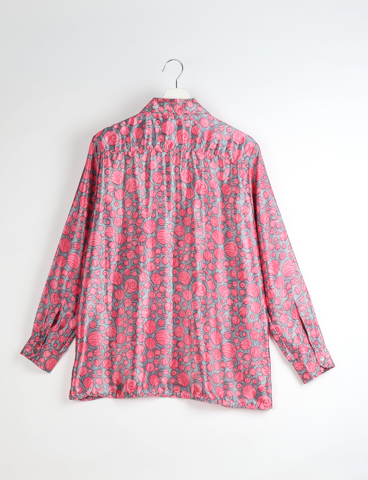 A person wearing a Resort Shirt, a sustainable fashion choice made from recycled materials.