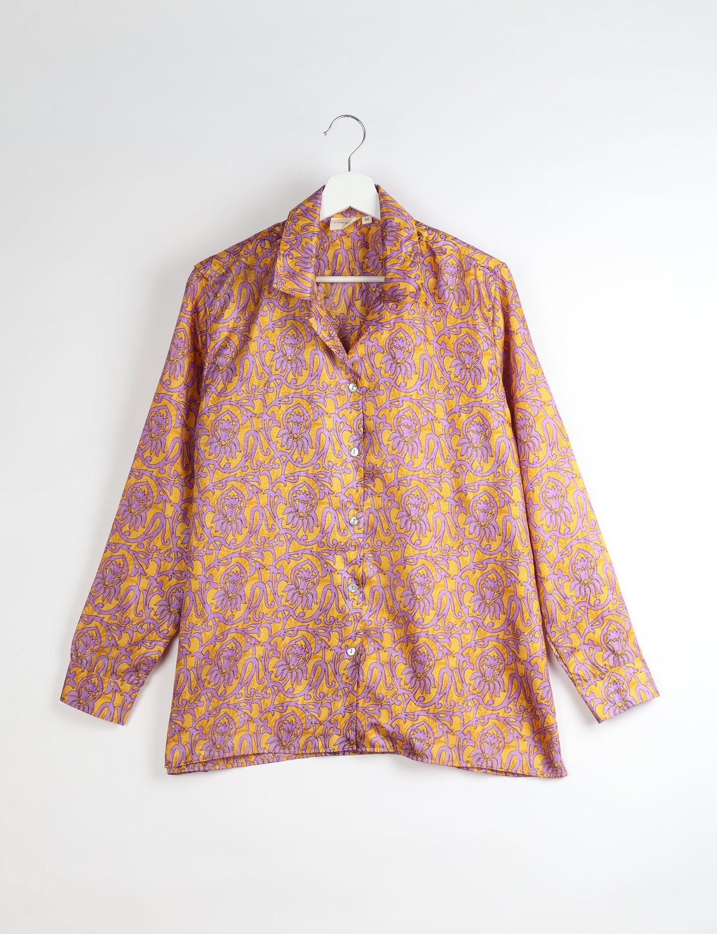 A person wearing a Resort Shirt, a sustainable fashion choice made from recycled materials.