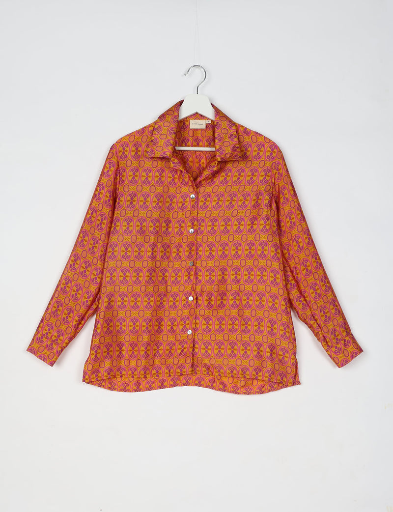 Orange long-sleeve resort shirt with pink oval floral micro design, button front, and spread collar hanging on white hanger