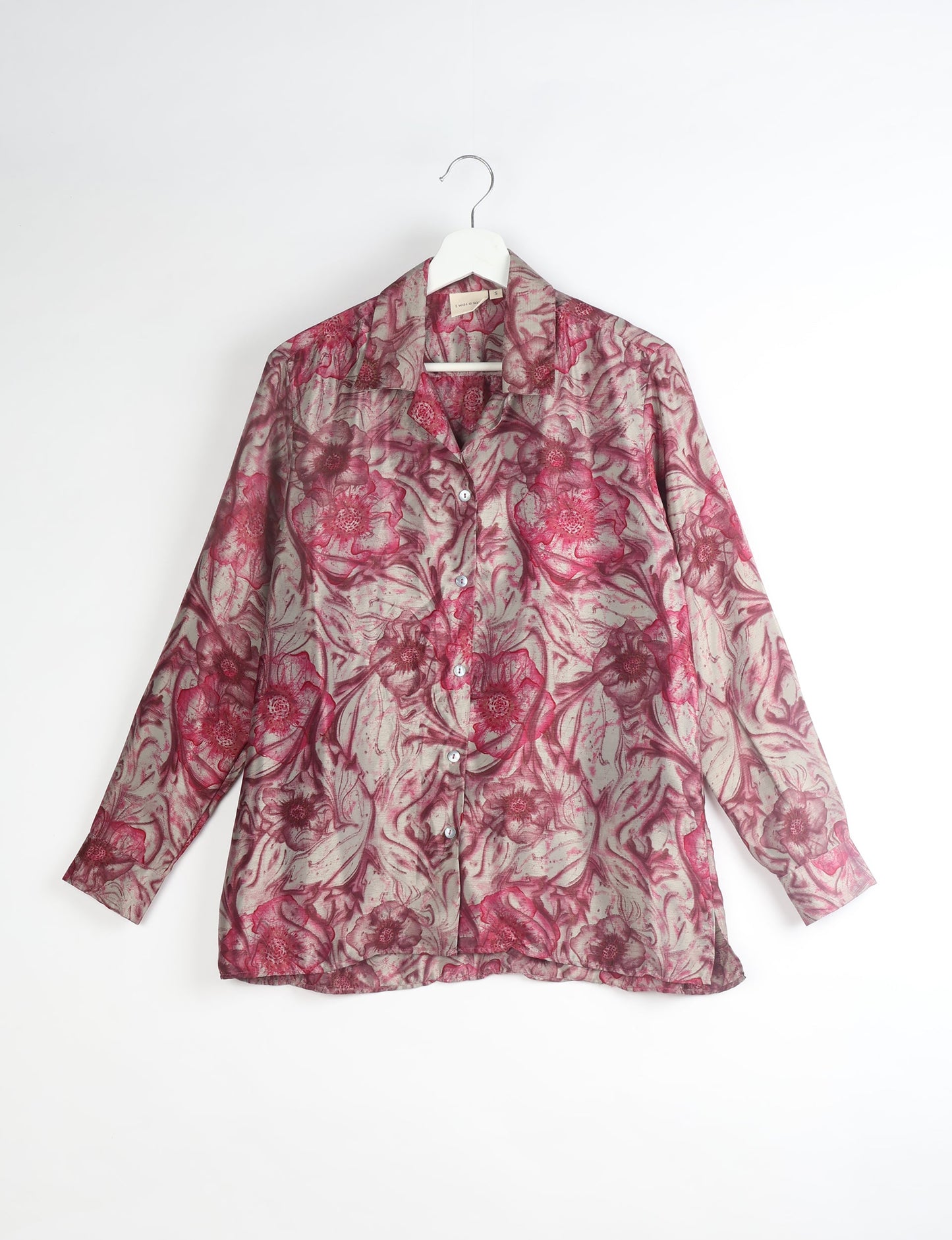 A person wearing a Resort Shirt, a sustainable fashion choice made from recycled materials.