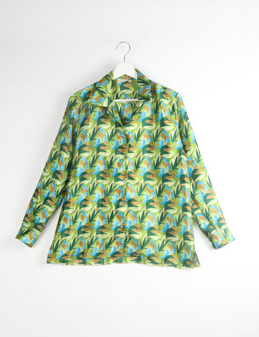 A person wearing a Resort Shirt, a sustainable fashion choice made from recycled materials.