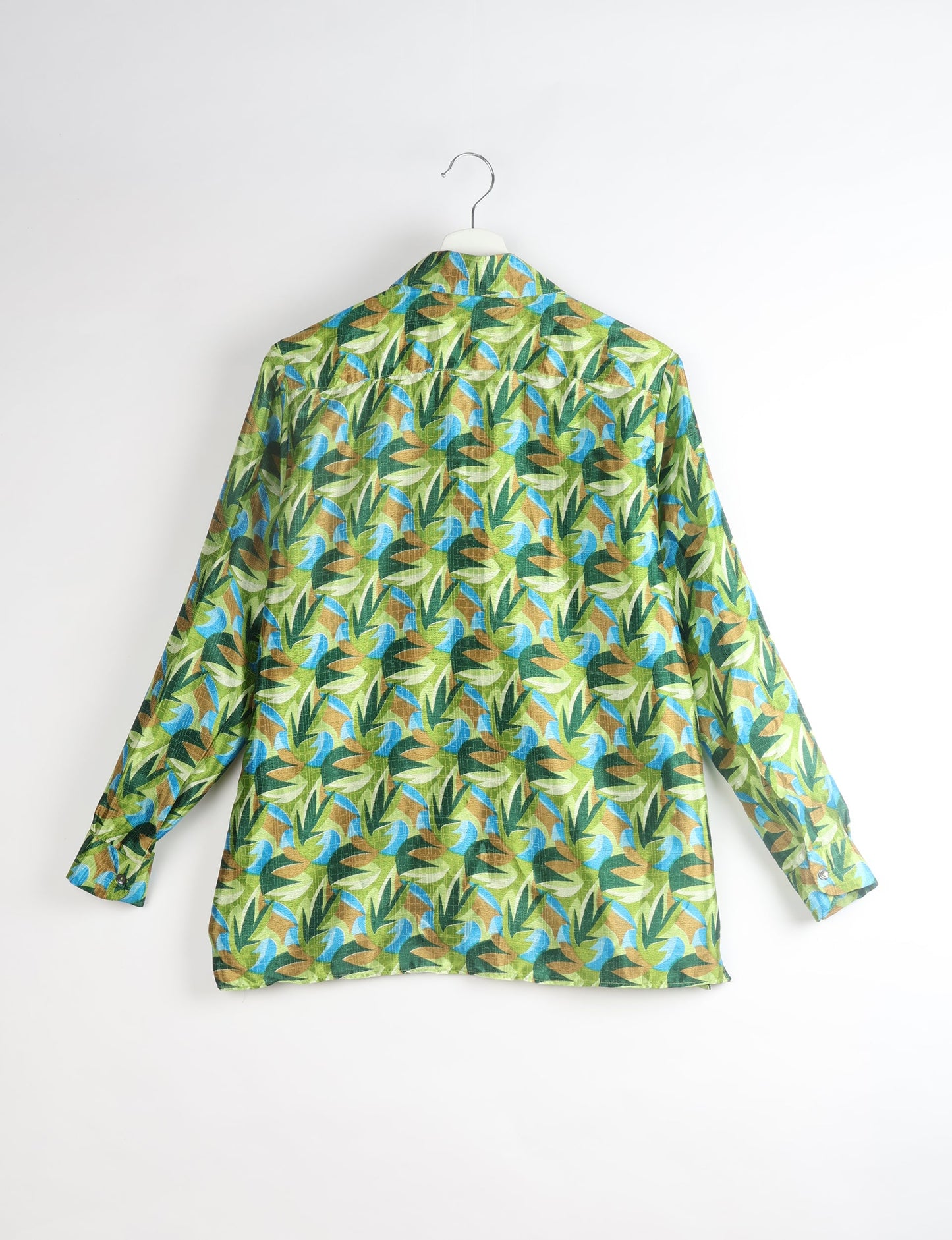 A person wearing a Resort Shirt, a sustainable fashion choice made from recycled materials.