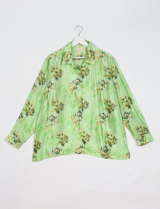 A person wearing a Resort Shirt, a sustainable fashion choice made from recycled materials.