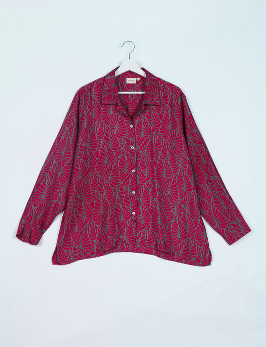 A person wearing a Resort Shirt, a sustainable fashion choice made from recycled materials.