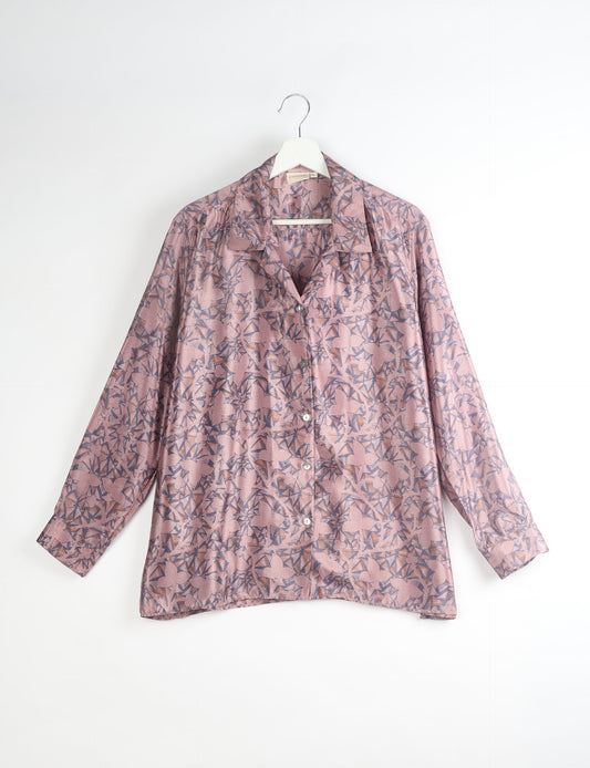 A person wearing a Resort Shirt, a sustainable fashion choice made from recycled materials.