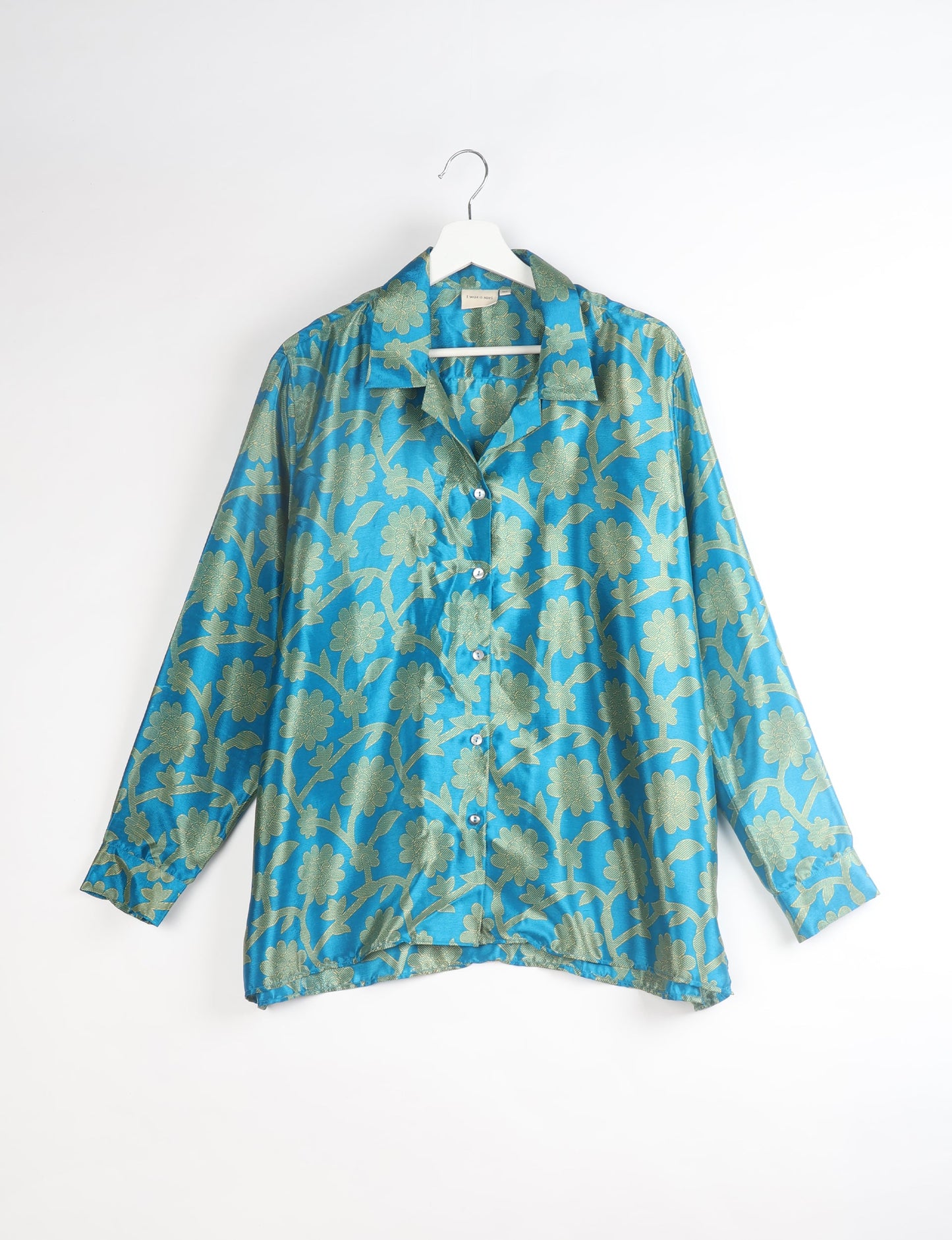 A person wearing a Resort Shirt, a sustainable fashion choice made from recycled materials.