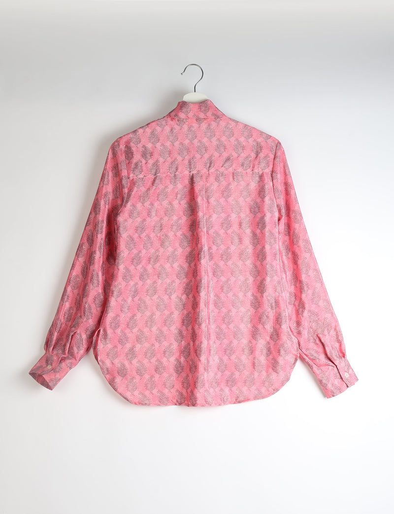Pink long-sleeve shirt with gray leaf pattern, buttoned cuffs, and back pleat, hanging on white hanger, back view
