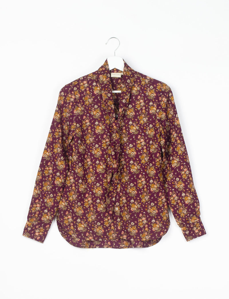 Long-sleeve button-up shirt with red floral pattern on dark purple fabric, displayed on white hanger against white background