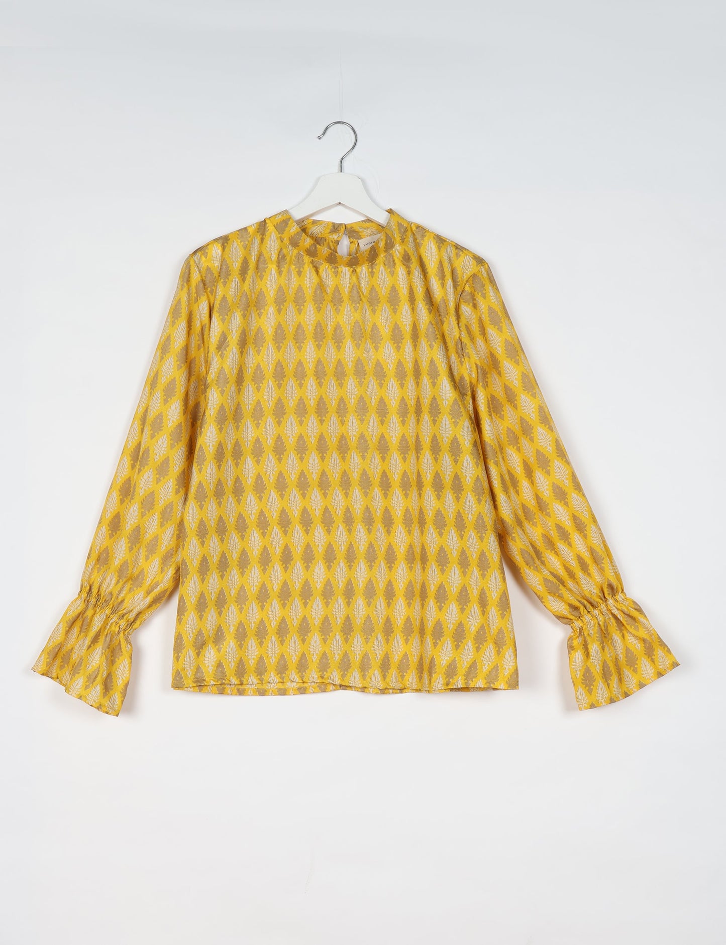 Flowing blouse with peasant sleeves and gathered neckline made from upcycled garments and repurposed clothing, showcasing eco clothing and fair trade fashion in a stylish, comfortable design.