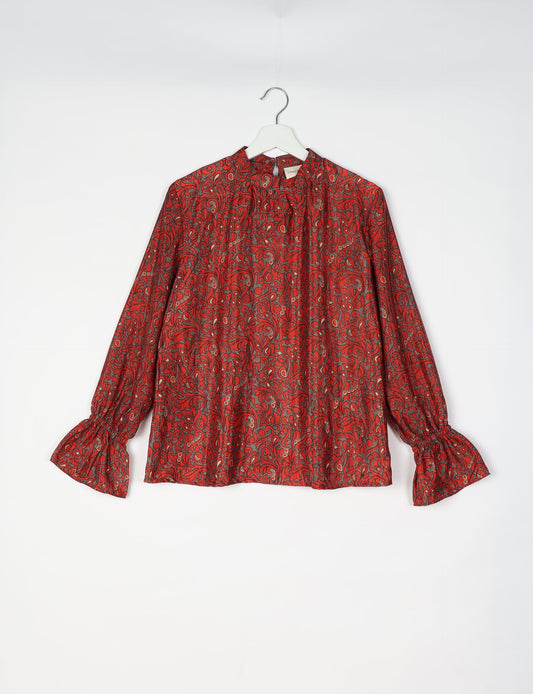 Flowing blouse with peasant sleeves and gathered neckline made from upcycled garments and repurposed clothing, showcasing eco clothing and fair trade fashion in a stylish, comfortable design.