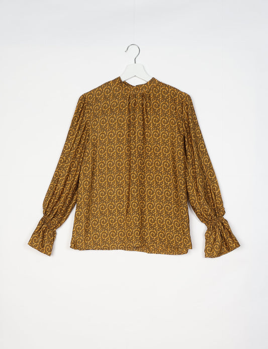 Flowing blouse with peasant sleeves and gathered neckline made from upcycled garments and repurposed clothing, showcasing eco clothing and fair trade fashion in a stylish, comfortable design.