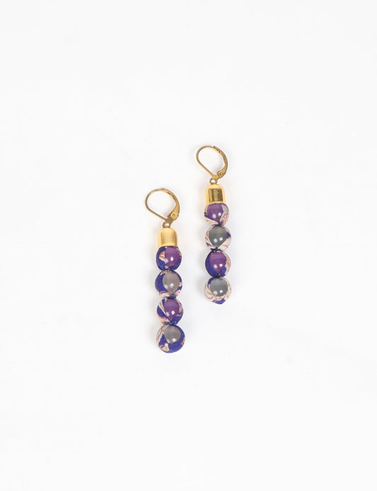 Experience the allure of Beaded Dangler Earrings, a fusion of recycled glass beads and pre-loved sari fabric. Skin-friendly with hypoallergenic hooks, these earrings bring a touch of sustainability to your accessory collection.