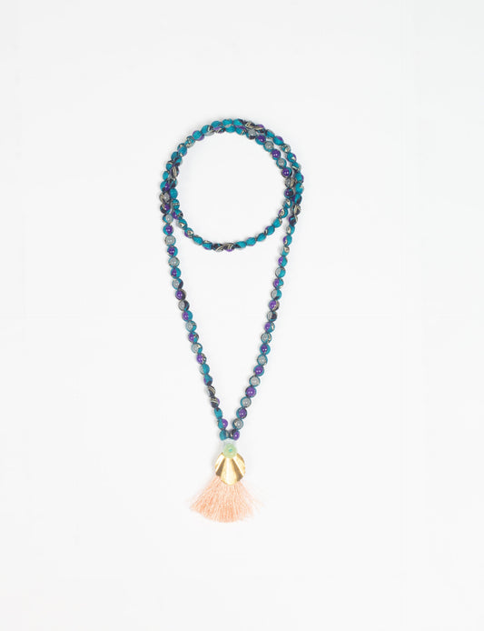 Discover elegance in our Beaded Tassel Necklace, meticulously handcrafted with glass beads, a silk tassel, and a metallic pendant. Hypoallergenic metal hooks provide a skin-friendly and stylish accessory. Length: 57 cm / 22.5 inches.