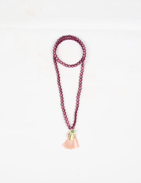 Discover elegance in our Beaded Tassel Necklace, meticulously handcrafted with glass beads, a silk tassel, and a metallic pendant. Hypoallergenic metal hooks provide a skin-friendly and stylish accessory. Length: 57 cm / 22.5 inches.