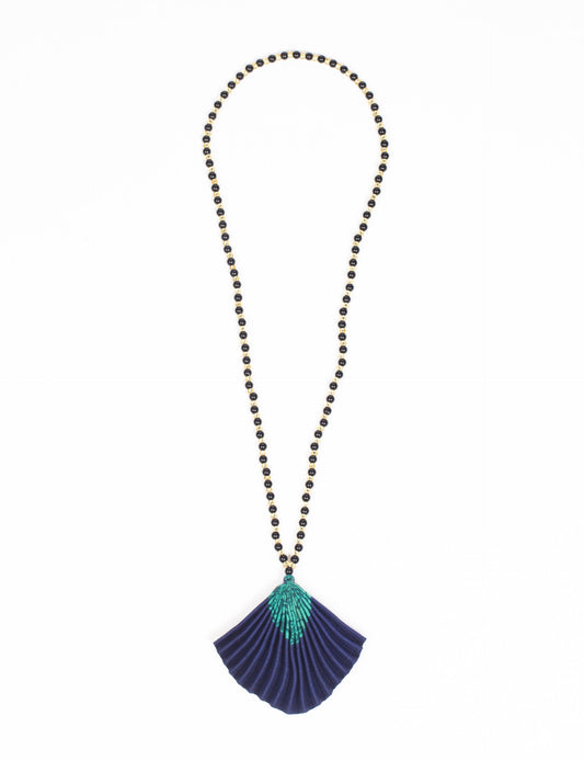 Dive into sustainable fashion with our PLEATED NECKLACE, a creation by talented female artisans in Mumbai. The pleated fan pendant, made from upcycled saris, hangs on a colorful necklace crafted from glass beads, embellished with sparkling glass crystals. An ethical, green fashion statement for conscious styling.