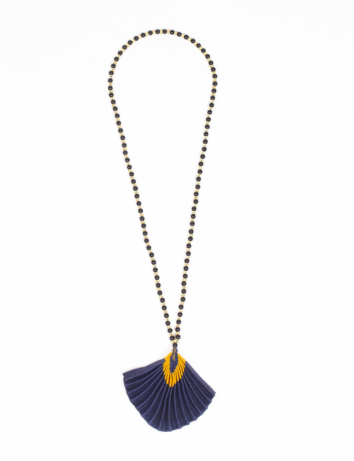 Long necklace with alternating black and gold beads and a pleated blue fabric pendant with a yellow abstract pattern