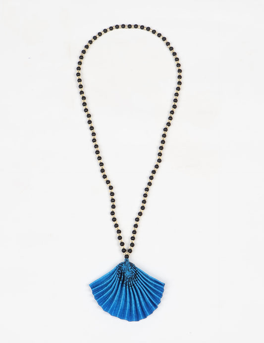 Dive into sustainable fashion with our PLEATED NECKLACE, a creation by talented female artisans in Mumbai. The pleated fan pendant, made from upcycled saris, hangs on a colorful necklace crafted from glass beads, embellished with sparkling glass crystals. An ethical, green fashion statement for conscious styling.
